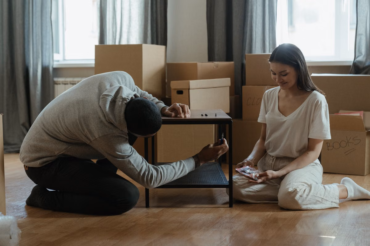 SwiftHaul Moving team assembling a dresser in a Philadelphia apartment